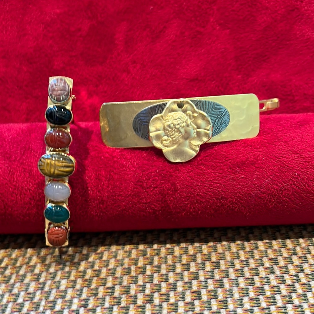 Two beautiful barrettes !! One is scarb and one is gold  silhouette.